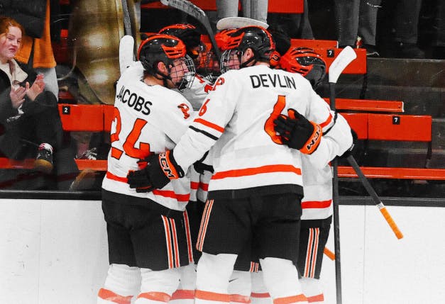 princeton men's ice hockey team in a huddle