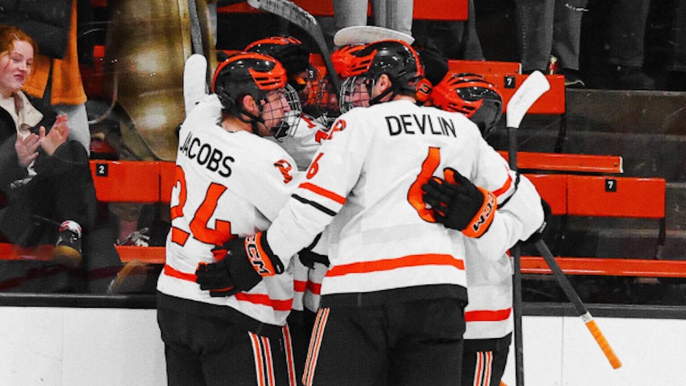 princeton men's ice hockey team in a huddle