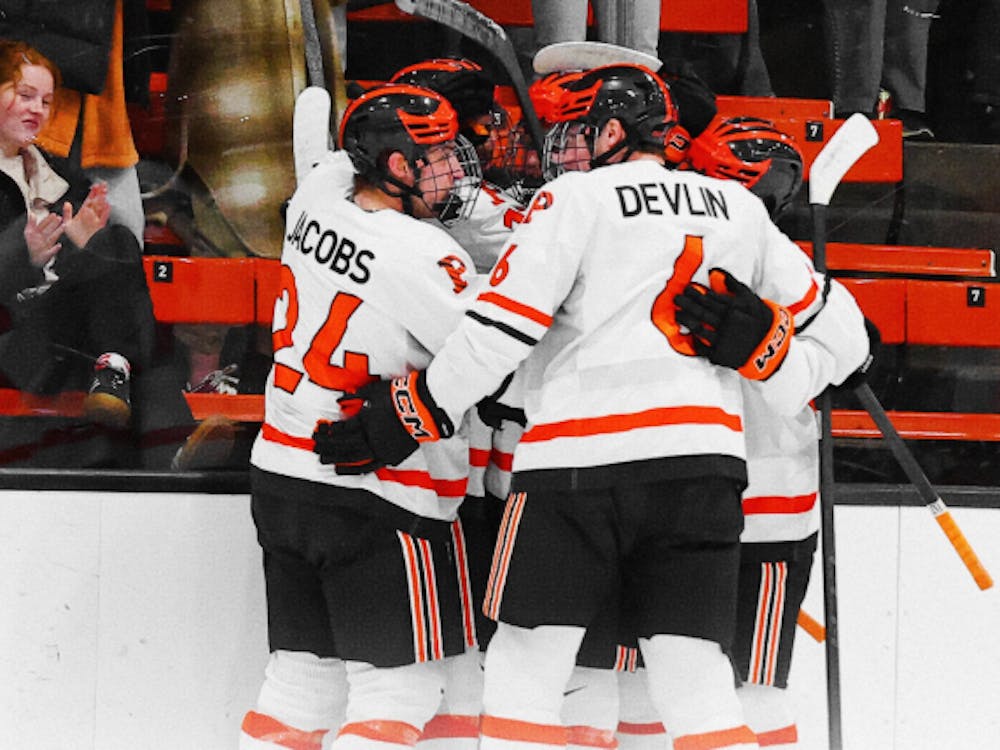 princeton men's ice hockey team in a huddle