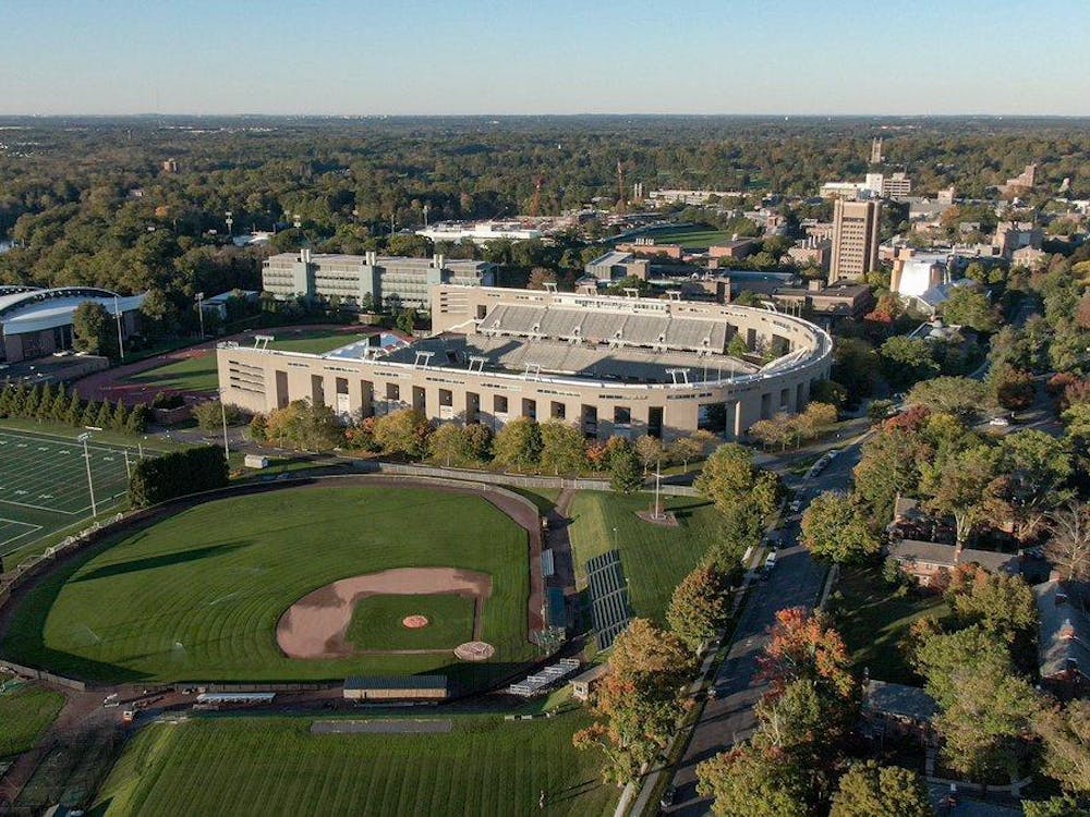 Princeton baseball field seen from aerial view, along with gray football stadium and domed basketball court. 