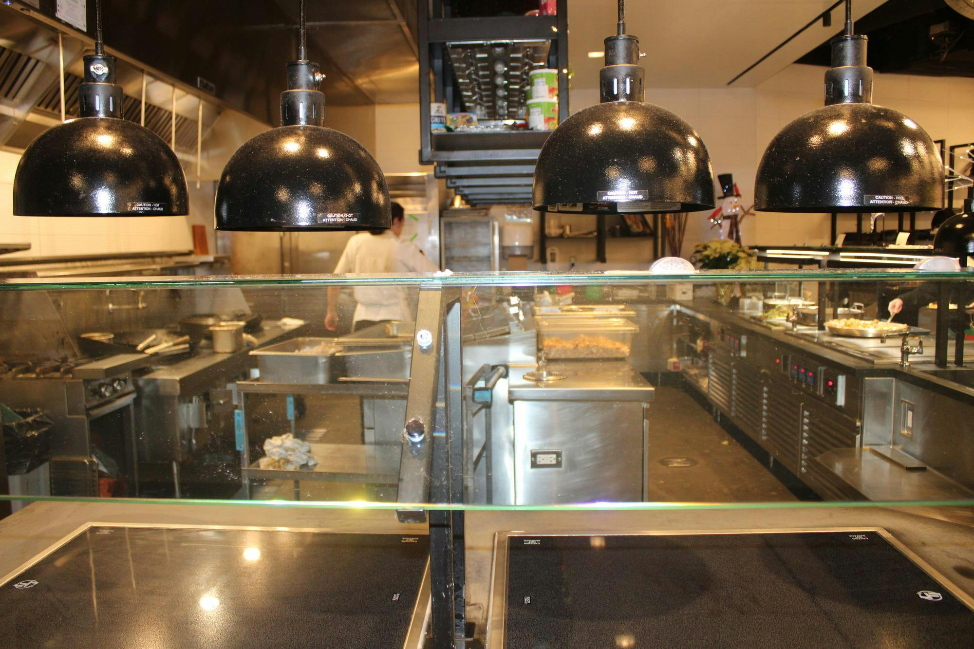 An empty food station at a dining hall.