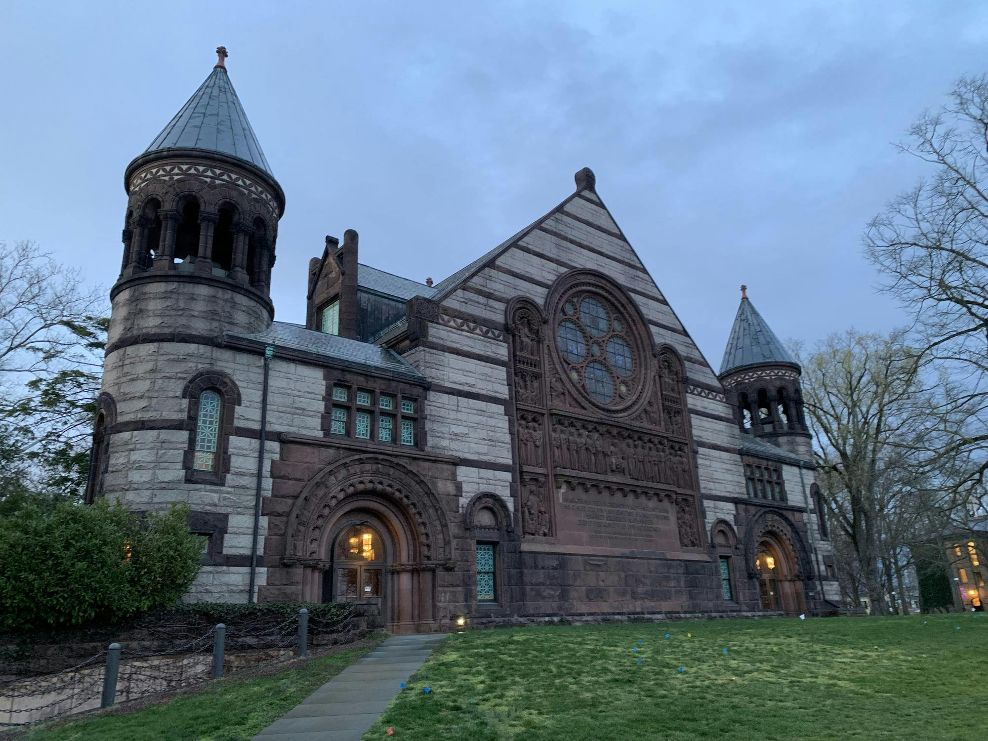 The outside of a theater during sunset.