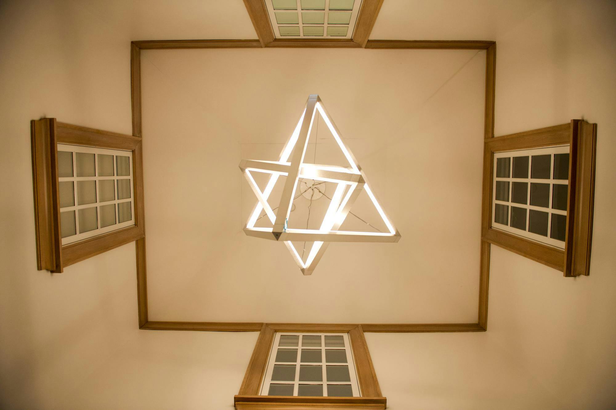 A light fixture of two triangular prisms. 