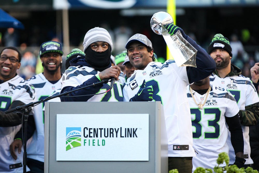 <p>Marshawn Lynch (left) celebrates the Super Bowl XLVIII victory alongside quarterback Russell Wilson (right).</p>
<h6>Photo Credit: andrewtat94 / Flickr</h6>