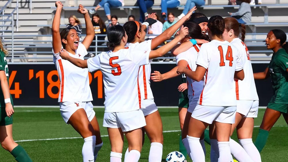 princeton soccer players celebrate after a goal