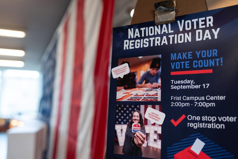 A poster reads 'National Voter Registration Day: Make your vote count! Tuesday, September 17, Frist Campus Center, 2:00 - 7:00pm'