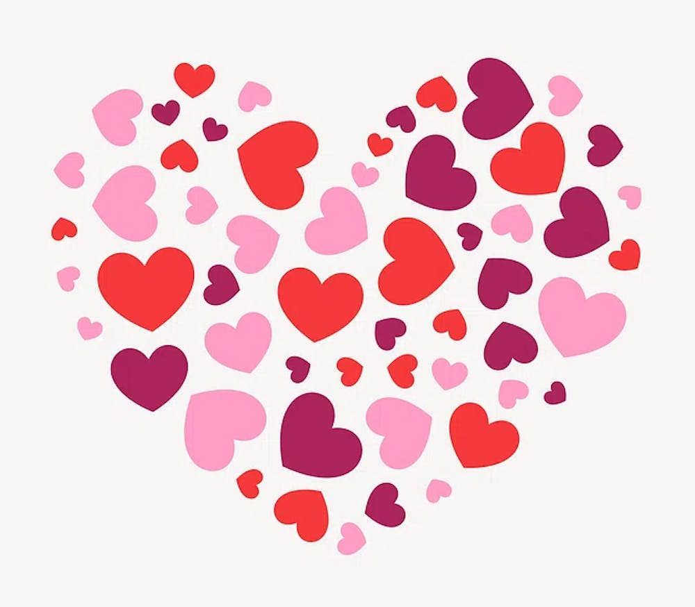 Many red, pink, and purple hearts, assembled in the shape of a larger heart.
