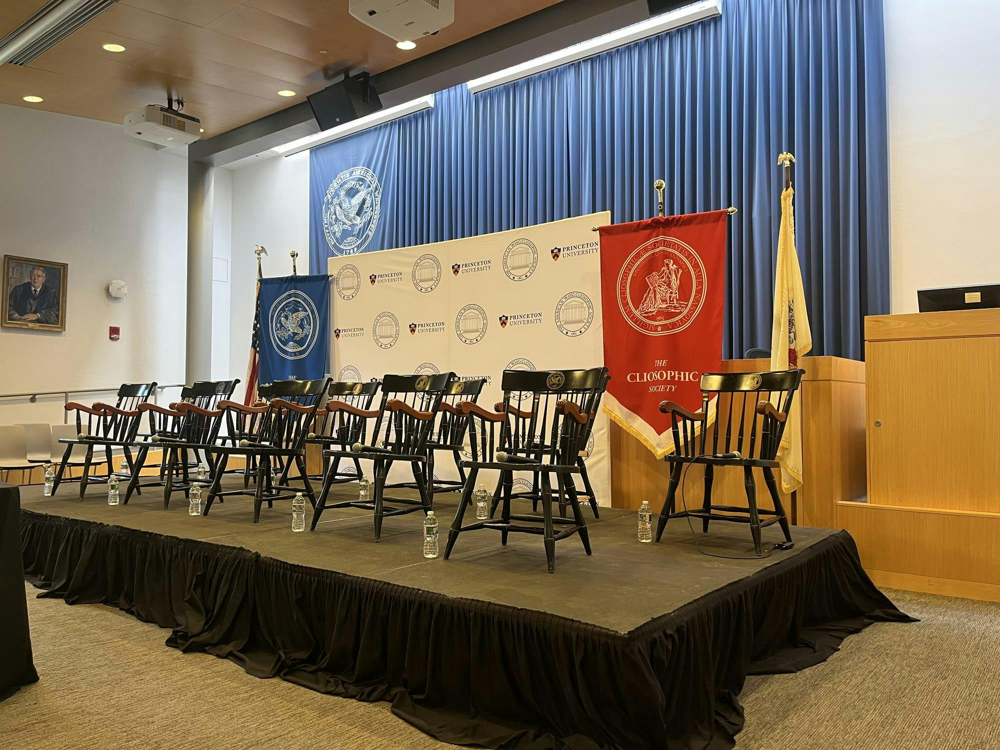 Empty chairs on a platform. 