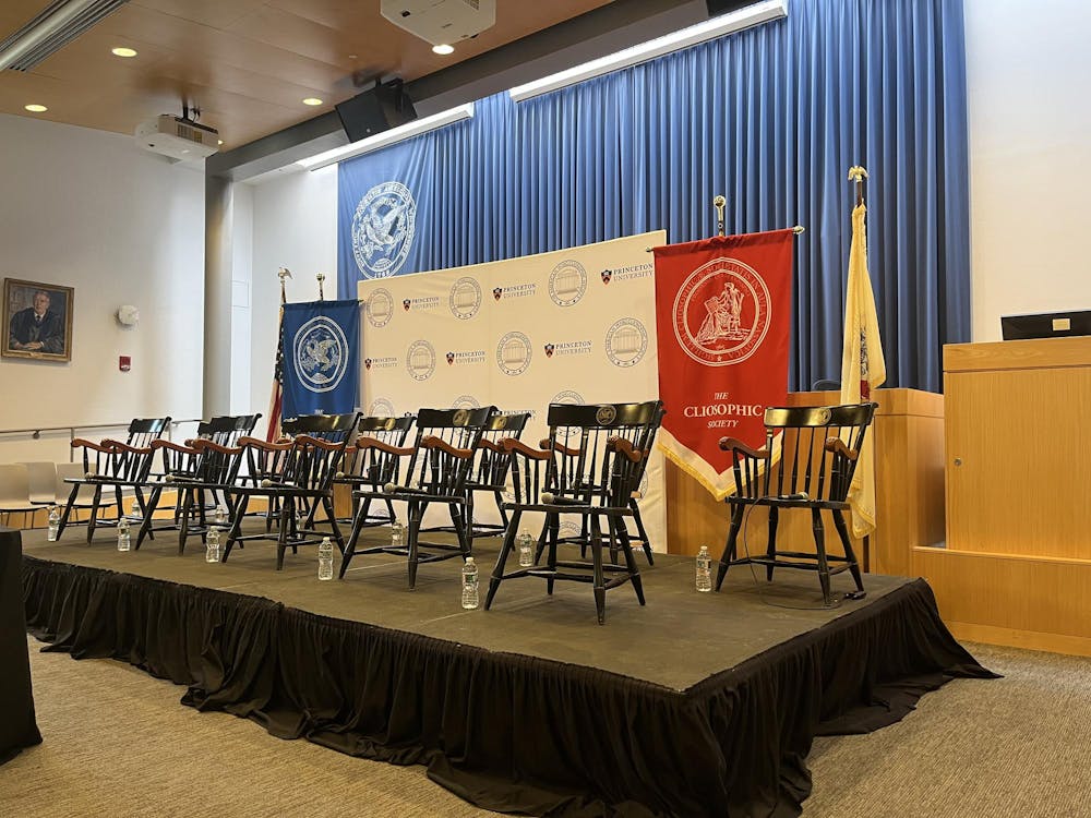 Empty chairs on a platform. 