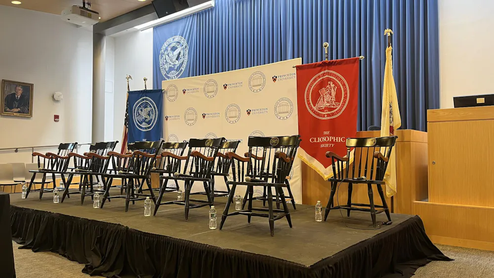 Empty chairs on a platform.