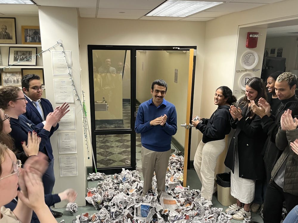 <h5>Rohit Narayanan ’24 enters the newsroom for the first time as 147th Editor-in-Chief elect. He is pelted with hundreds of crumpled newspapers, as is tradition.&nbsp;</h5>
<h6>Caitlin Limestahl / The Daily Princetonian</h6>