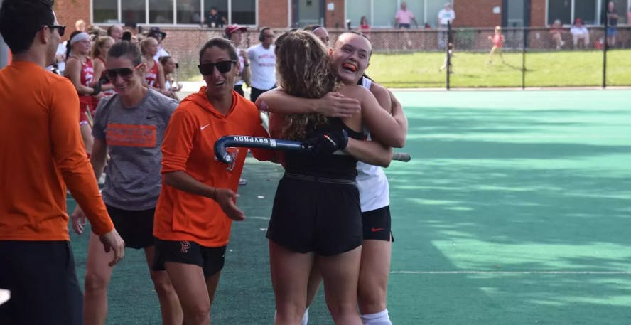 Princeton field hockey player smiling.
