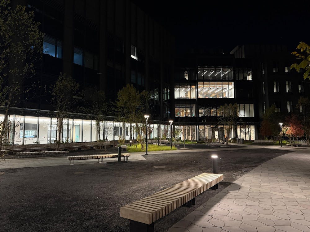 A building dimly lit, at night.
