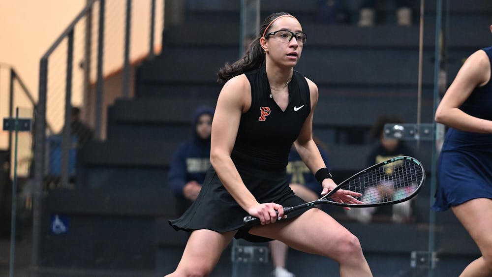 Women’s squash player in action.