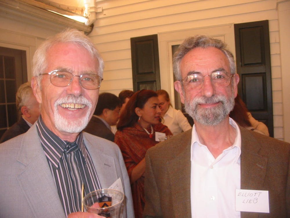 <p>Pierre Adrien&nbsp;Piroué, on the left, with Elliot H. Lieb, Eugene Higgins Professor of Physics, Emeritus, at Department of Physics picnic.</p>
<h6>Photo Courtesy of Kirk T. McDonald</h6>