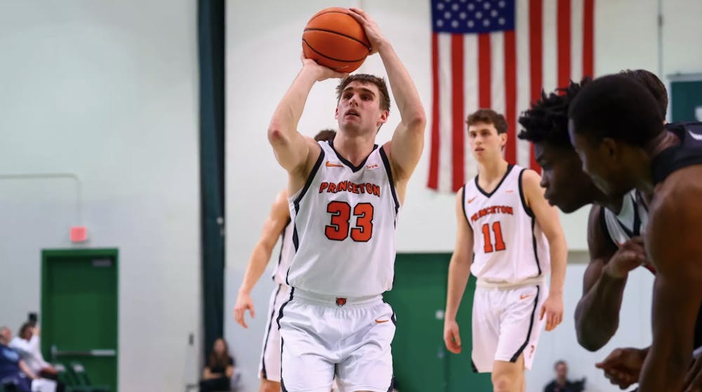 Princeton men’s basketball player shooting a ball.