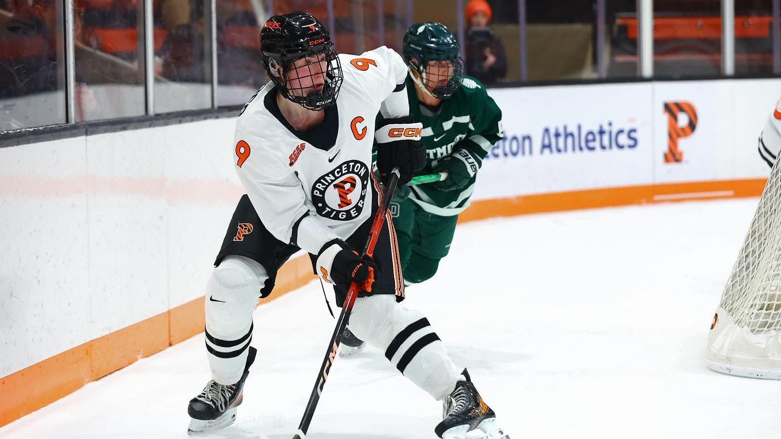 Women’s ice hockey players battling for the puck.