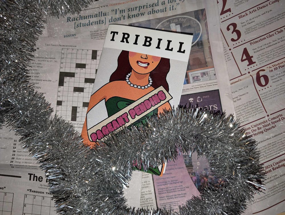 Pamphlet reading "Tribill" with a cartoon woman wearing a sash that reads "Pageant Pending." The pamphlet sits atop scattered newspaper.