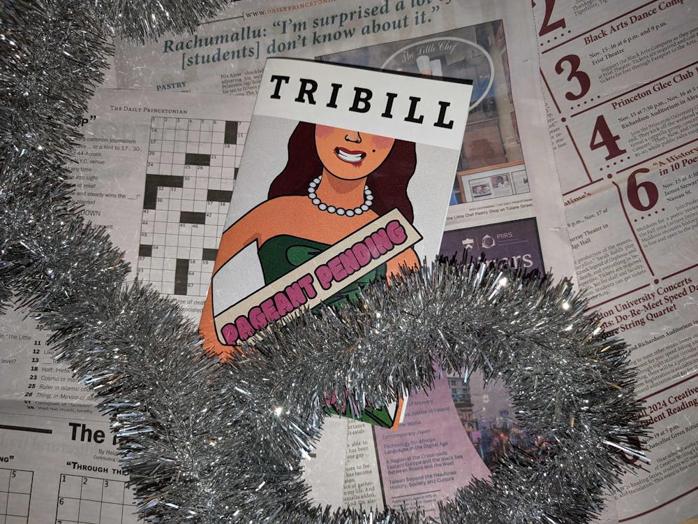Pamphlet reading "Tribill" with a cartoon woman wearing a sash that reads "Pageant Pending." The pamphlet sits atop scattered newspaper.
