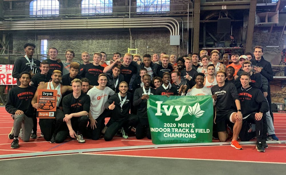 Men's track and field with 2020 Indoor Champion banner