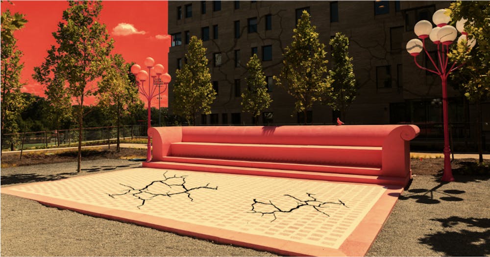 <h5>The pink concrete couch outside the new colleges serves as a refuge for students with unfinished dorm rooms.</h5>
<h6>Walker Penfield / The Daily Princetonian</h6>
