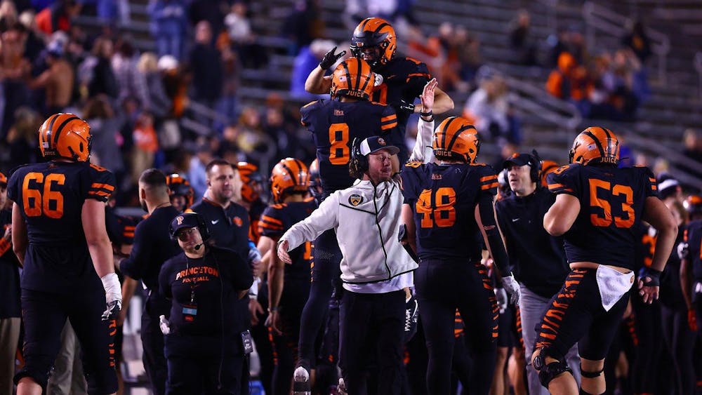 Players on sideline celebrate after a big play.