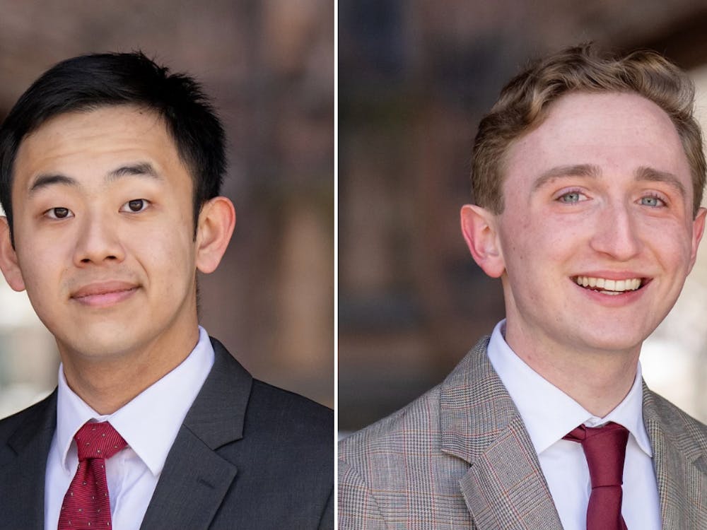 Two side-by-side headshots of students in suits and ties