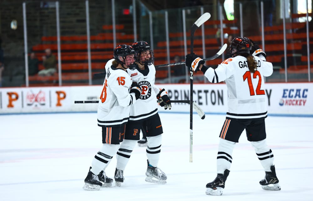 Princeton women’s hockey celebrating on the ice.