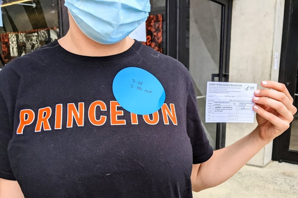 student with vaccine card