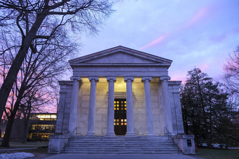 <h5>Whig Hall under the faint glow of a Tuesday morning sunrise.</h5><h6>Timothy Park / The Daily Princetonian</h6>
