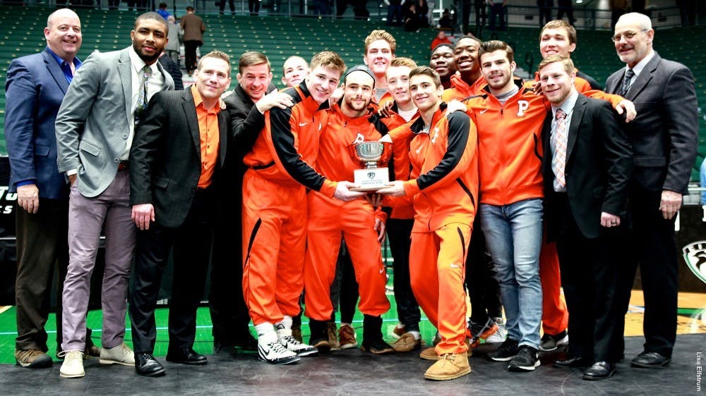 Princeton wrestling poses with its hardware after a third-place EIWA finish. Photo Credit: Lisa Elfstrum \ goprincetontigers.com
