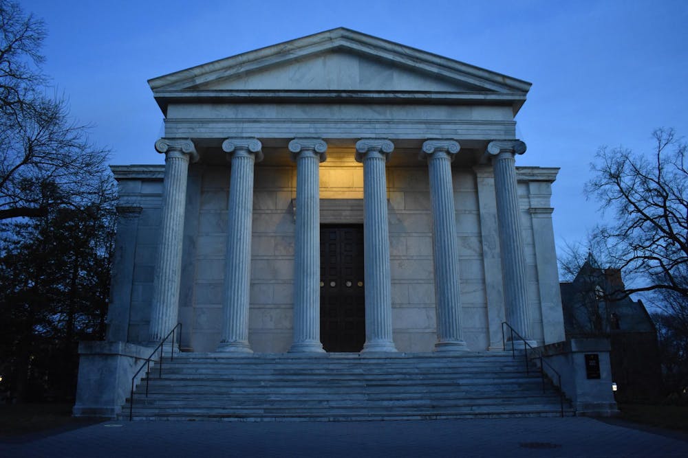 White building with columns in ominous evening lighting.