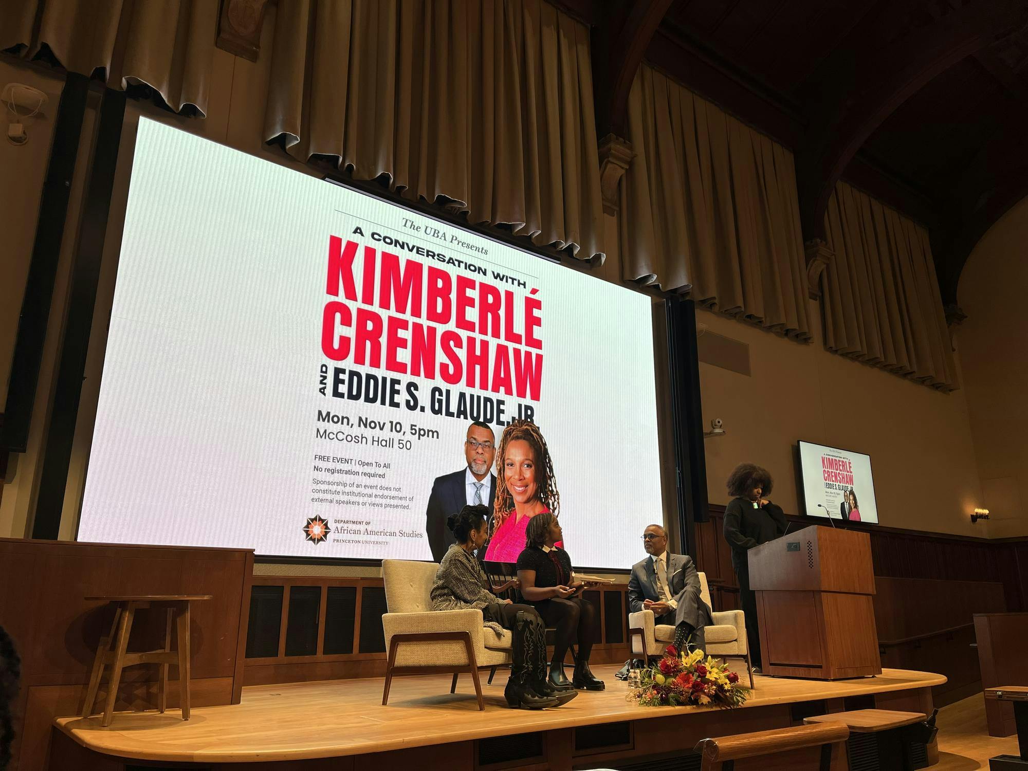 Crenshaw and Glaude on stage in McCosh 50. 