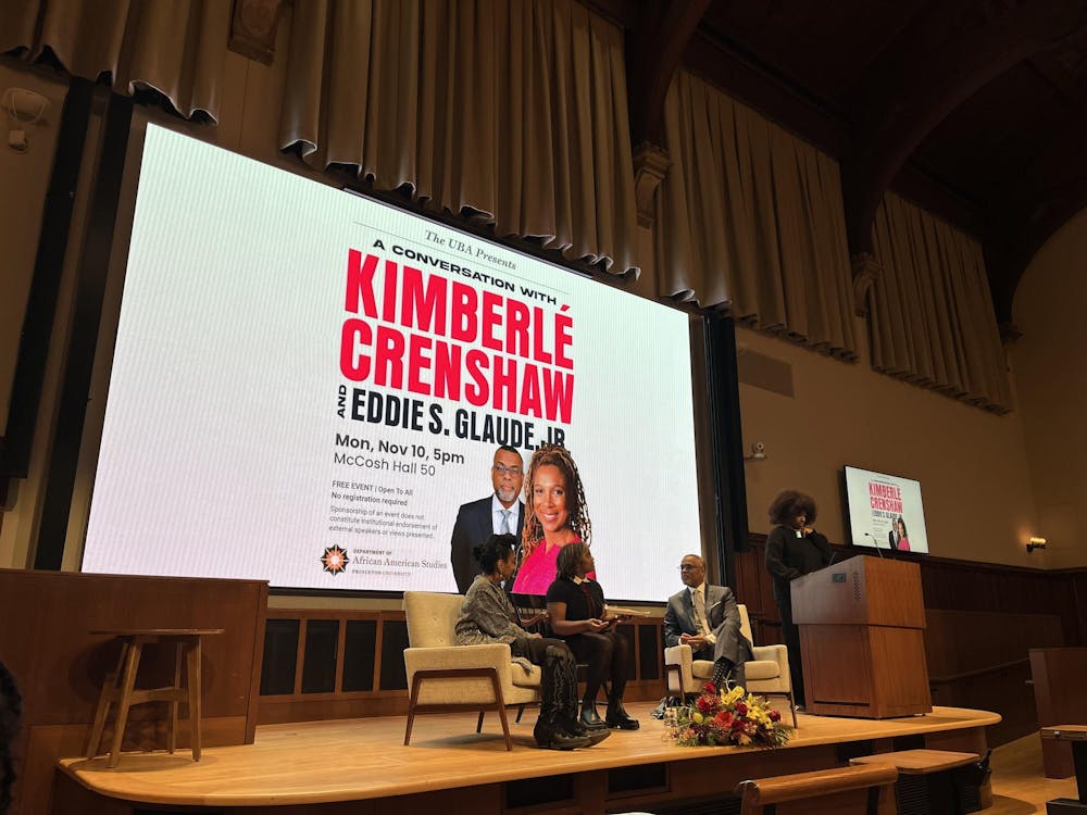 Crenshaw and Glaude on stage in McCosh 50.