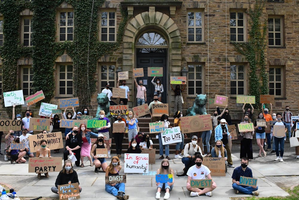 <h5>The students who held cardboard signs at a rally last April will get to say they contributed to divestment activism, unlike this unlucky first-year.</h5>
<h6>Mark Dodici / The Daily Princetonian</h6>