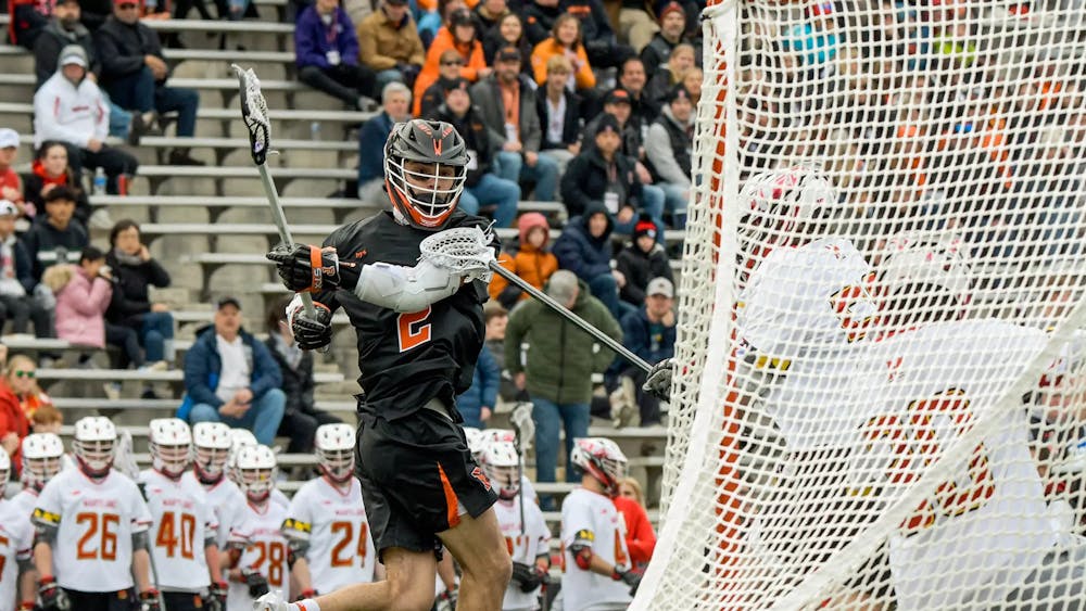 Attacker in Princeton uniform shoots a shot on goal against Maryland. 