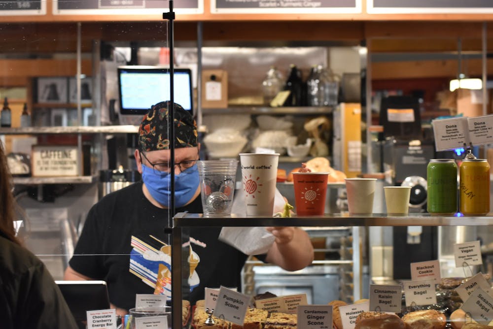 <h5>A man working in Small World Coffee.</h5>
<h6>Angel Kuo / The Daily Princetonian</h6>
