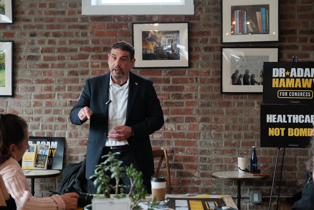 Candidate for NJ-12 Adam Hamawy standing and pointing his finger.