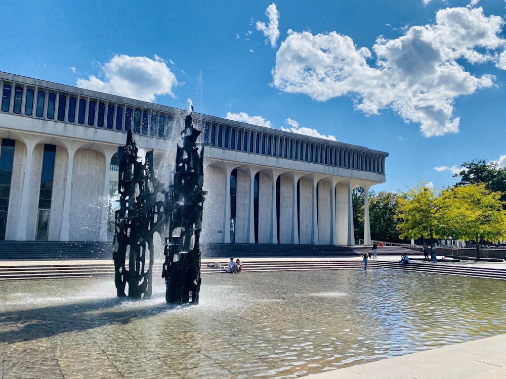 <h5>Students sit around the Fountain of Freedom on a sunny day.</h5>
<h6>Guanyi Cao / The Daily Princetonian</h6>