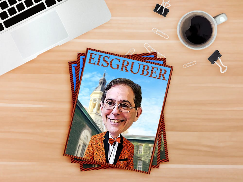 A magazine with a cartoon of Eisgruber at a lectern as he stands in front of Nassau Hall laying on a desk.