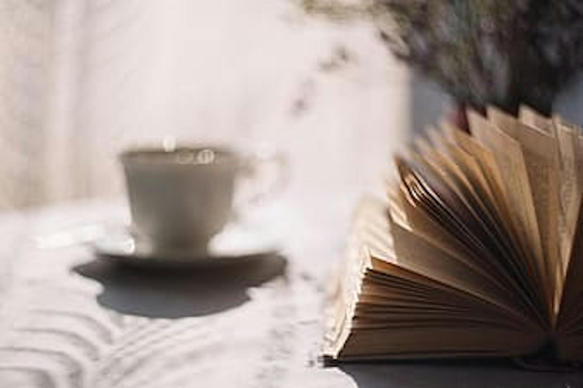 brown-book-open-near-white-ceramic-cup-during-daytime-thumbnail