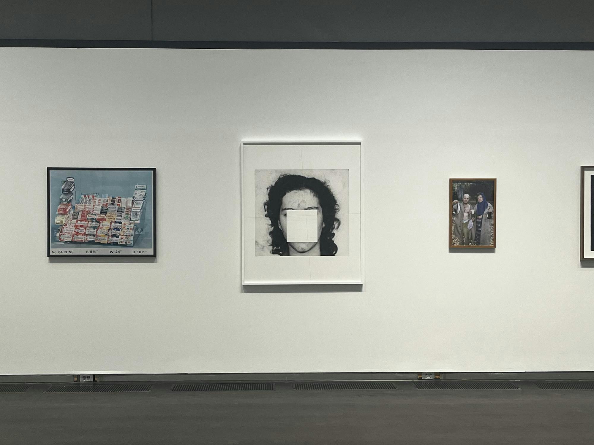 Three photos lined up on a white wall.