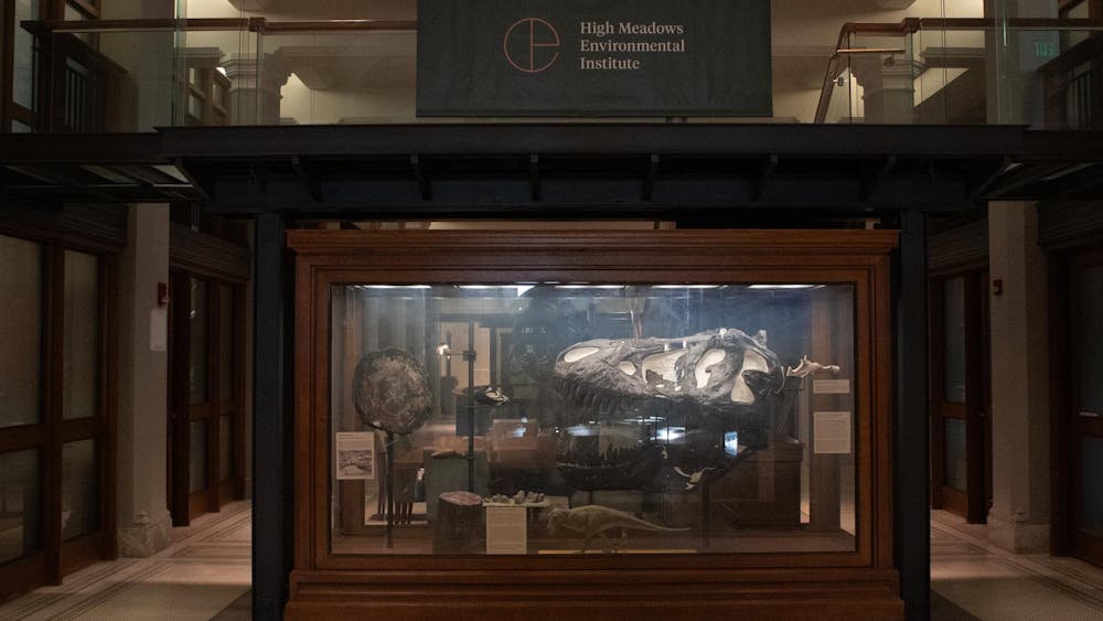 Photo of a High Meadows Environmental Institute banner above a display case of fossils.