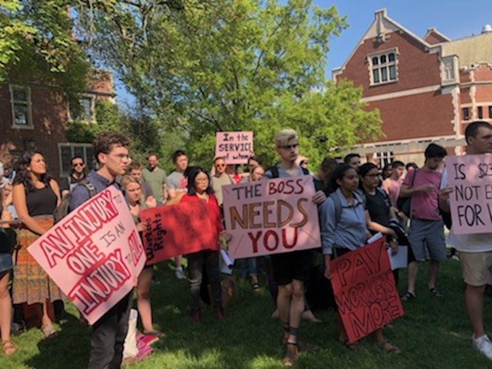 Students and YDS members holding signs at town hall.