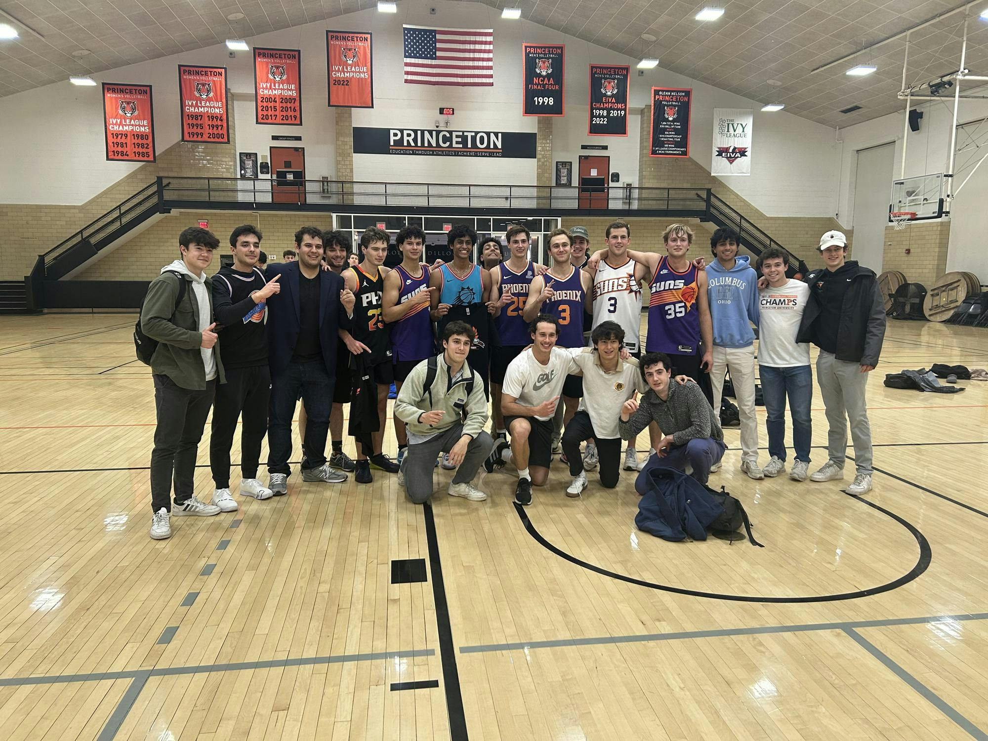 A group of men pose for a photo