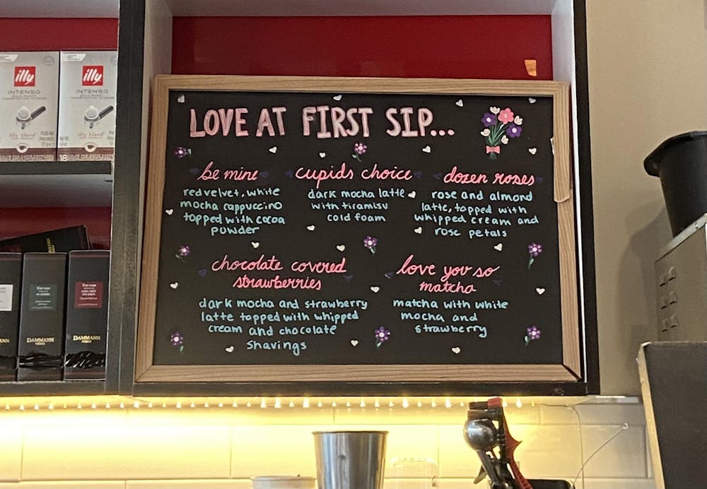 Chalkboard displays Valentine's Day menu at coffee shop.