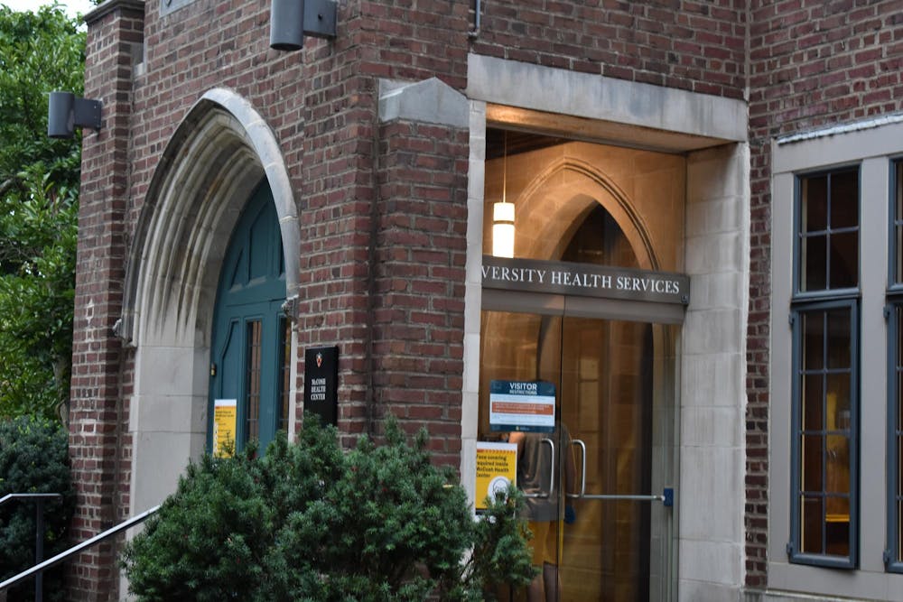 A zoomed-in photo of a brick building labeled “University Health Services.”