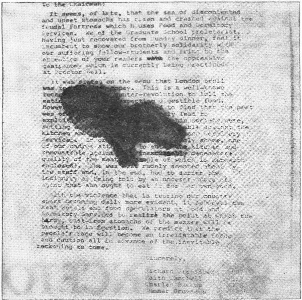 A black and white photo of the typed letter to the editor with a black smudge of London broil atop.