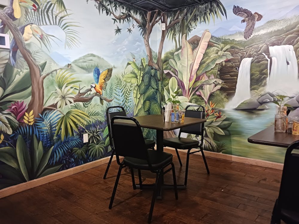 A table at Planted Plate in front of a rainforest mural.
Albert Lee / The Daily Princetonian