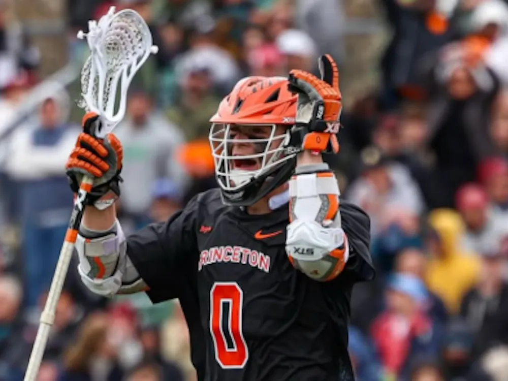 Junior attacker Colin Burns celebrates after he secures the game for the Tigers.